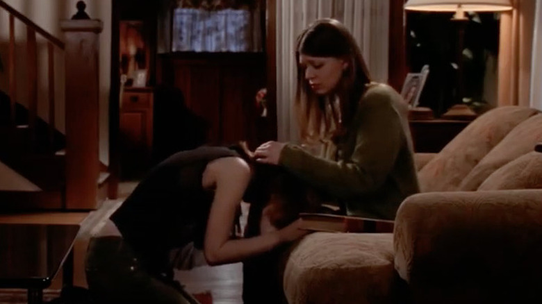 Buffy collapses in Tara's lap