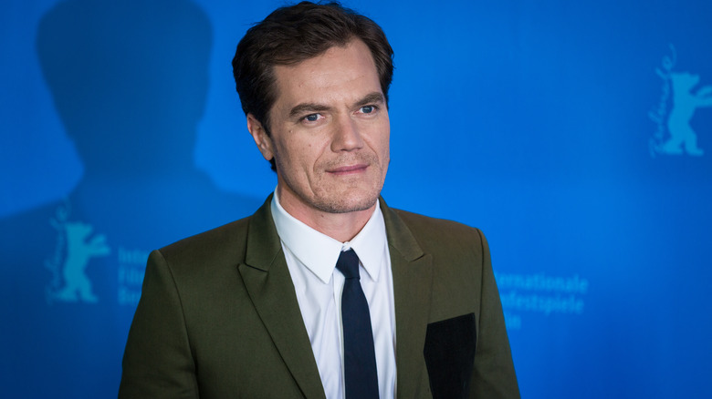 Michael Shannon smiling slightly for a photo