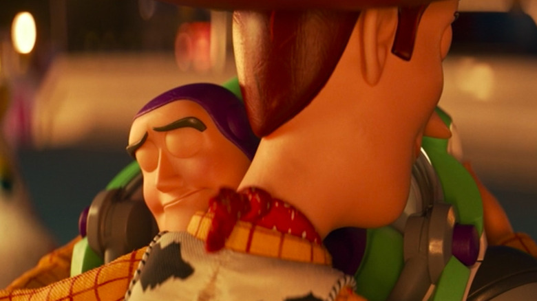 Buzz Lightyear and Woody hug