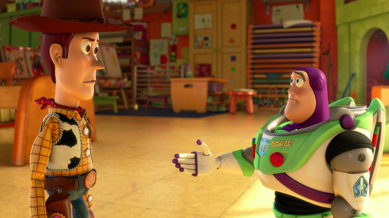 Buzz Lightyear extends his hand to Woody