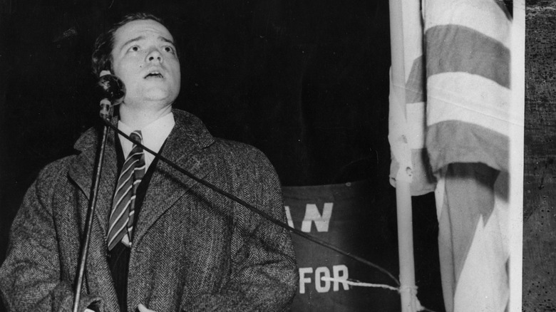 Orson Welles at microphone