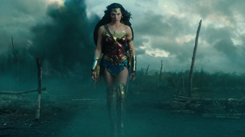 Wonder Woman walking across battlefield