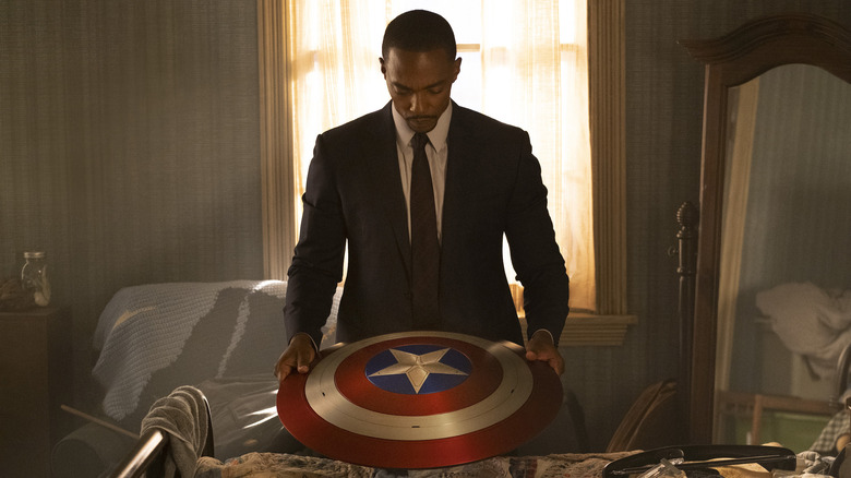 Sam Wilson holds shield