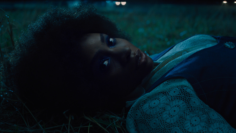 Monica Rambeau lying in the grass