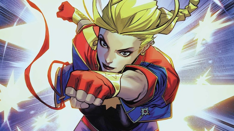 Captain Marvel punching in front of stars