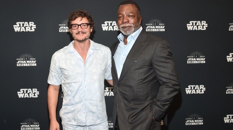 Pedro Pascal posing with Carl Weathers