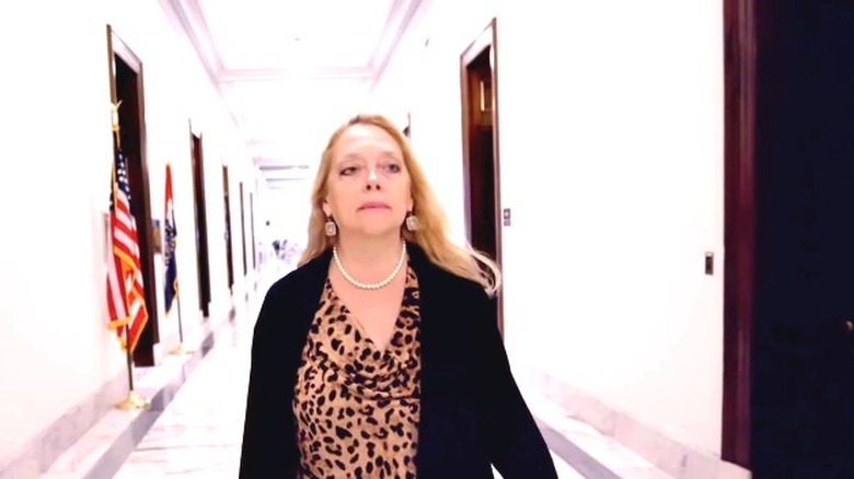 Carole Baskin Walks Down Hallway