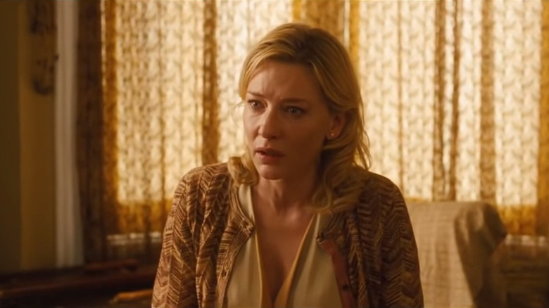 Blanchett sitting in yellow-colored room