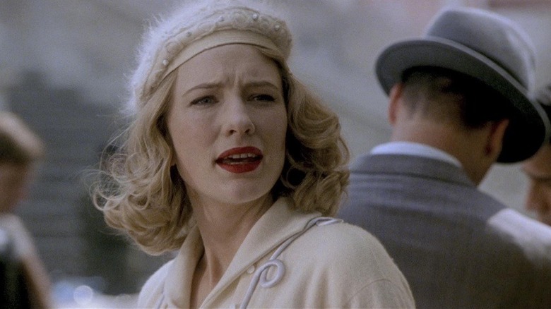 Blanchett with cream hat and red lipstick 