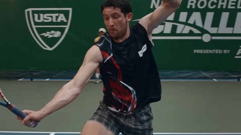 Josh O'Connor playing tennis