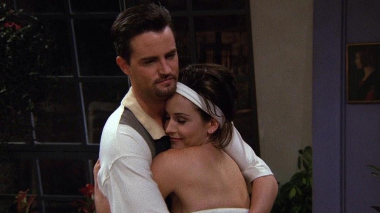 Friends Chandler and Monica hugging