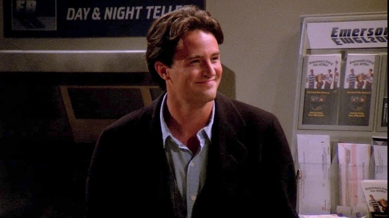 Chandler smiles in the ATM vestibule 