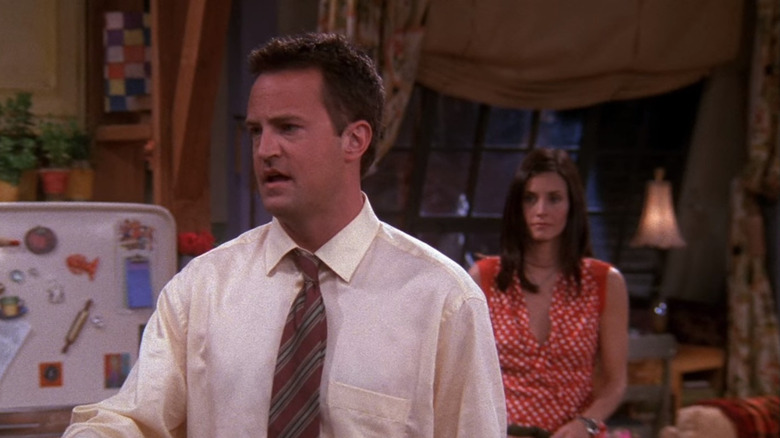 Monica stood behind Chandler