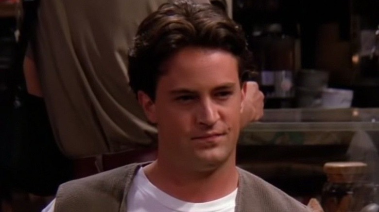 Chandler chats with friends at Central Perk