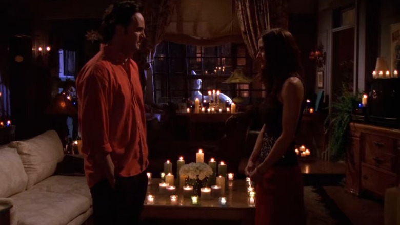 Chandler and Monica in candlelight