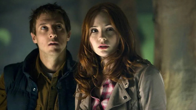 Amy and Rory look around a corner