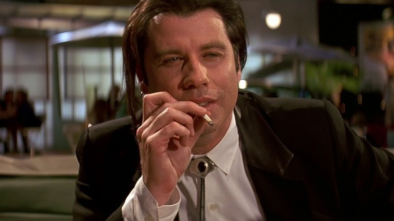 Vincent Vega smokes