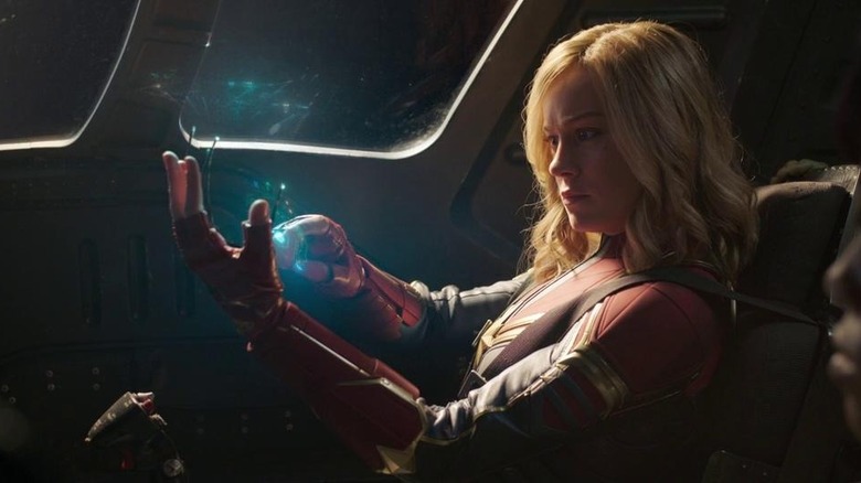 Captain Marvel looks at hand