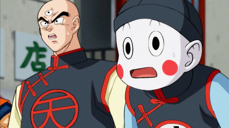 Tien and Chiaotzu look on, stunned