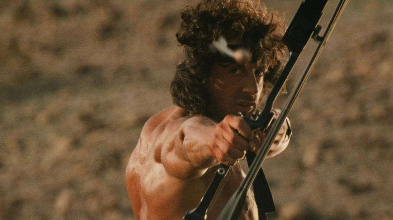 Rambo aims a bow