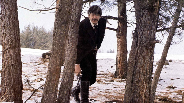 Charles Bronson hides in woods