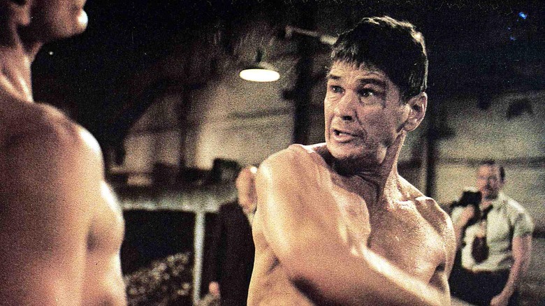 Charles Bronson throws a punch