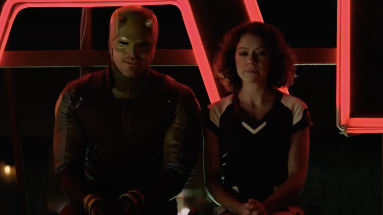 Daredevil in his yellow suit sitting next to Jennifer Walters