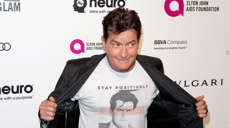 Charlie Sheen poses for photos 