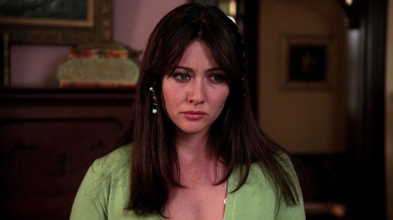 Prue Halliwell wearing green jumper