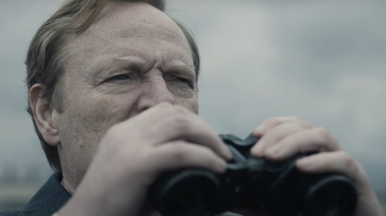 Stellan Skarsgård with binoculars