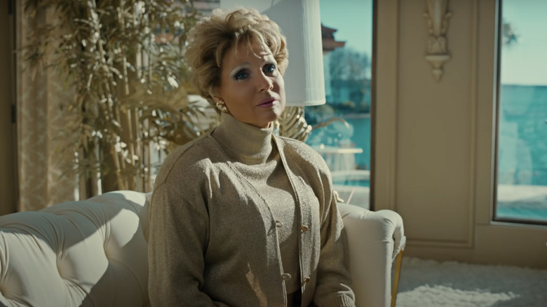 Jessica Chastain on couch as Tammy Faye