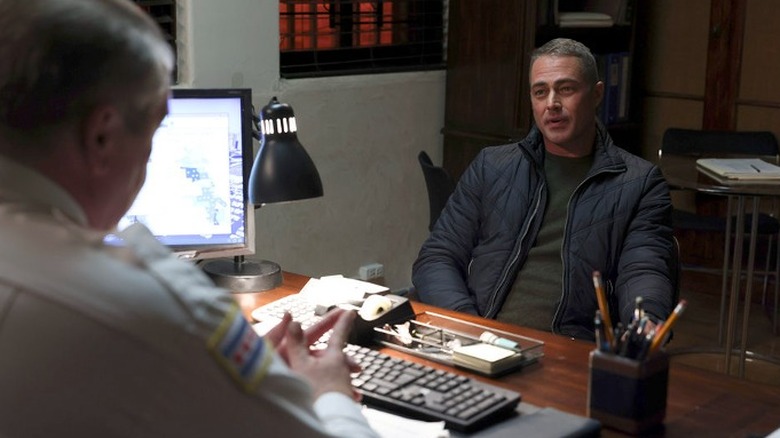 Kelly Severide seated in an office