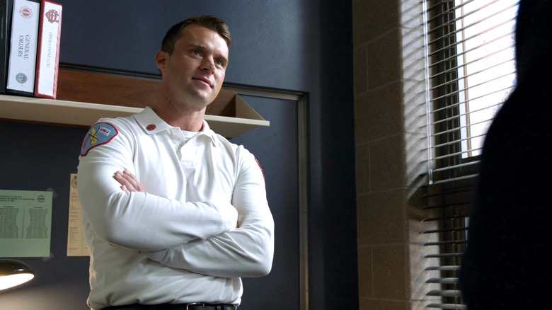 Matthew Casey standing with arms crossed