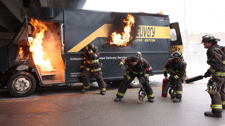 Firefighters extinguishing truck