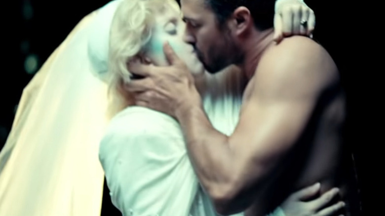 Taylor Kinney kissing Lady Gaga