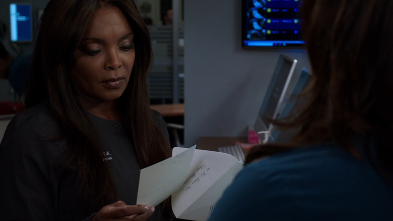 Maggie reads April and Ethan's wedding invite