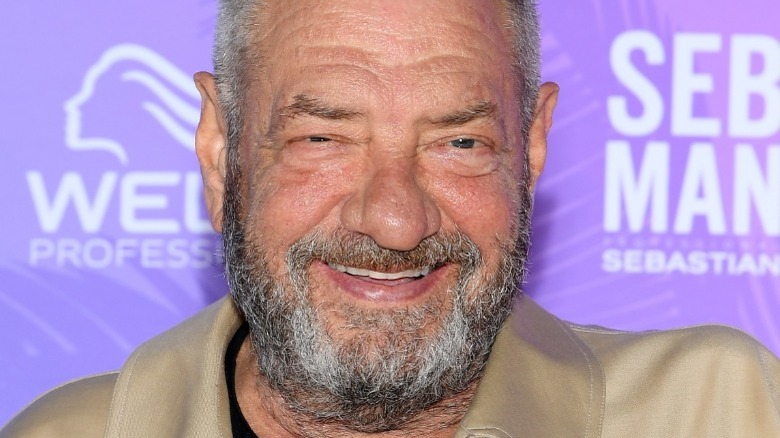 DIck Wolf smiles