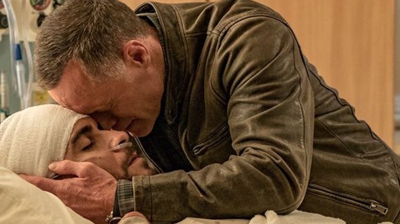 Jason Beghe cradling his dying son