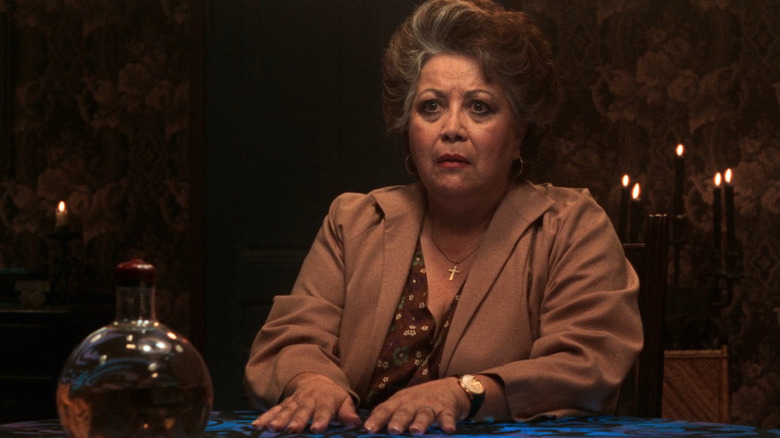 Rosa Santiago sitting at table