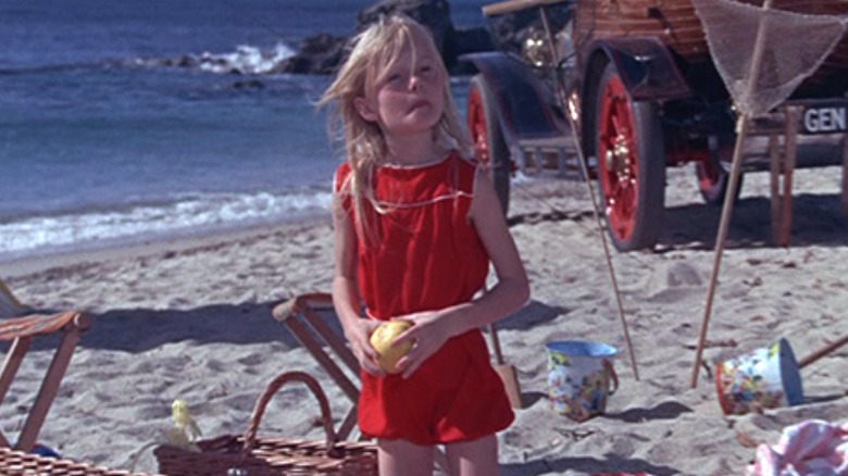 Jemina wearing red on beach