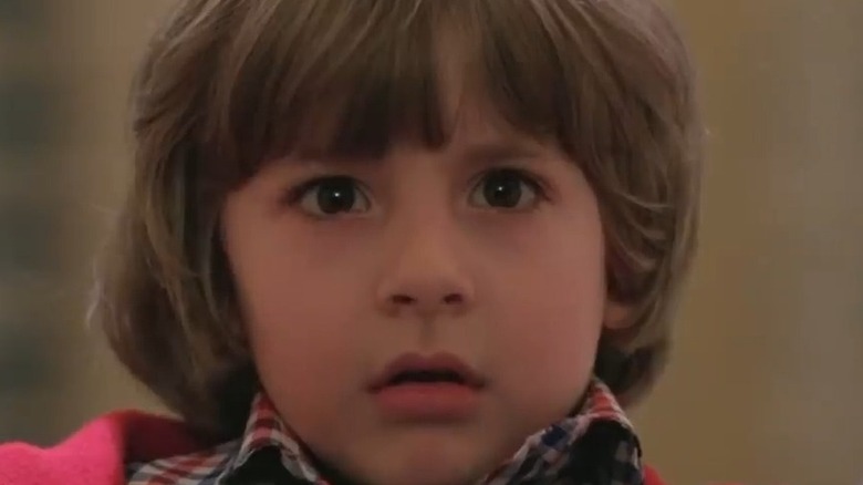 Danny Lloyd in The Shining, looking frightened in close-up