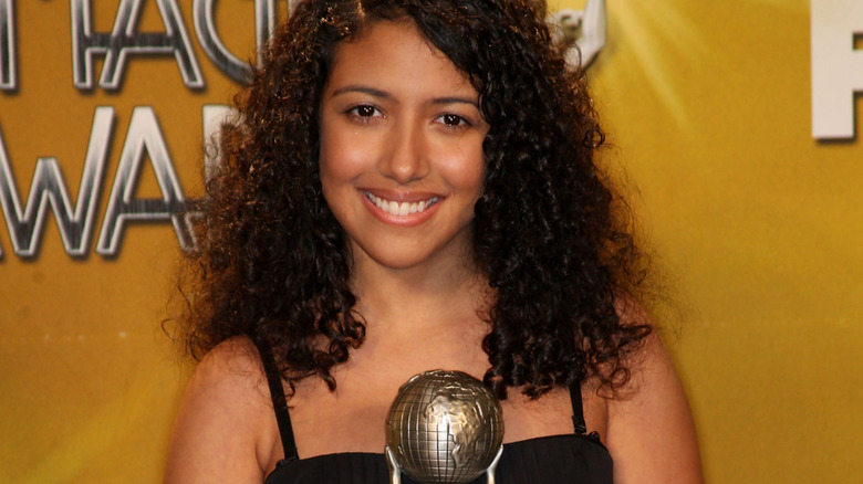 Caitlin Sanchez holding an award