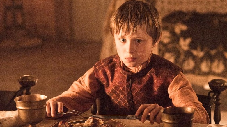 Tommen sits at a table on Game of Thrones (2011)