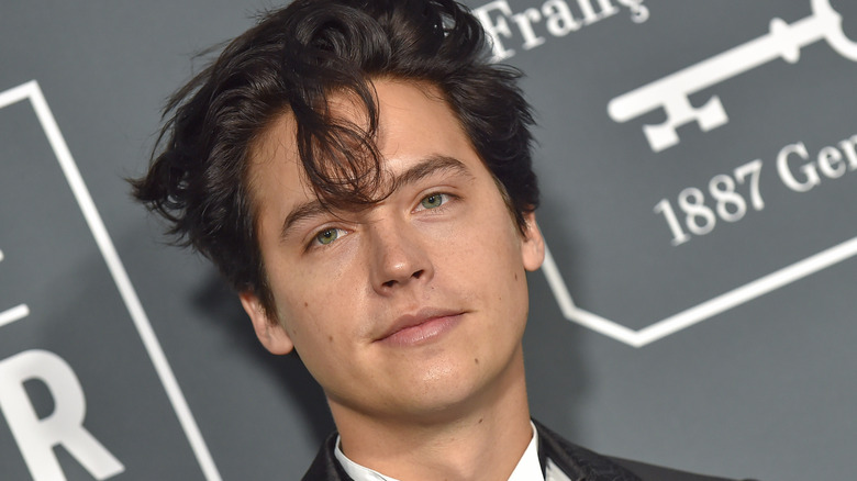 Cole Sprouse with hair in face