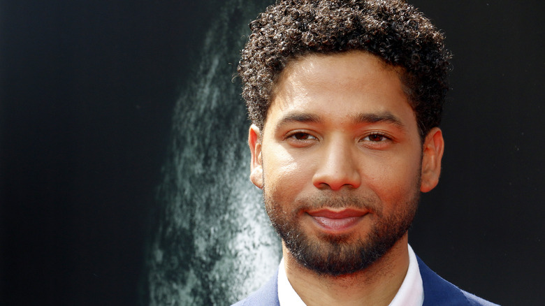 Jussie Smollett posing in a suit