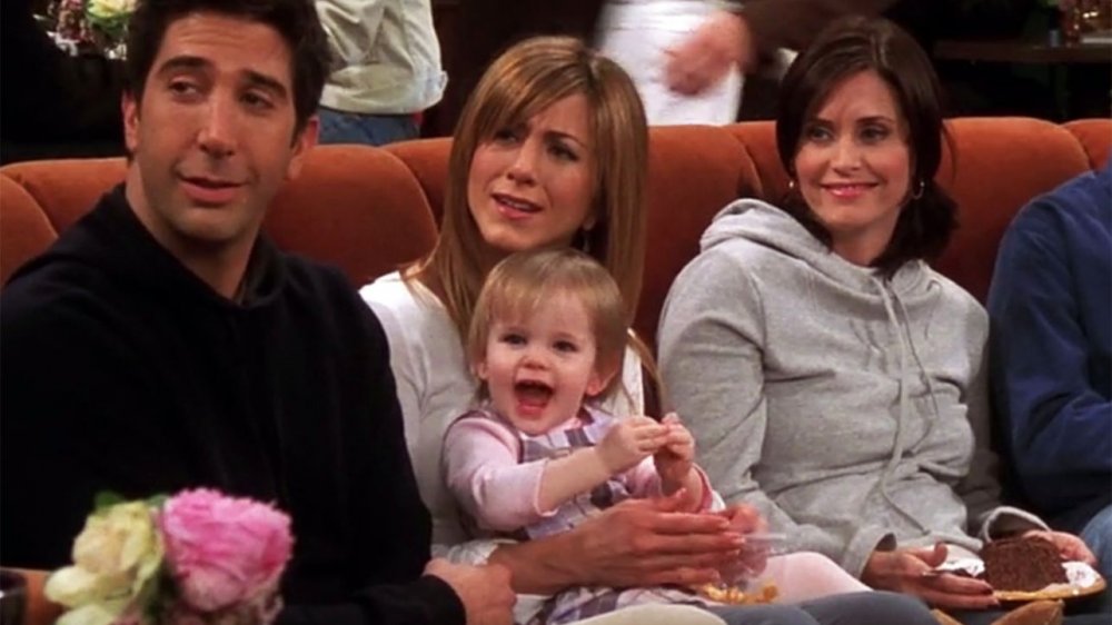 David Schwimmer as Ross Geller, Jennifer Aniston as Rachel Green, Courteney Cox as Monica Geller, and Cali or Noelle Sheldon as Emma Geller-Green in Friends