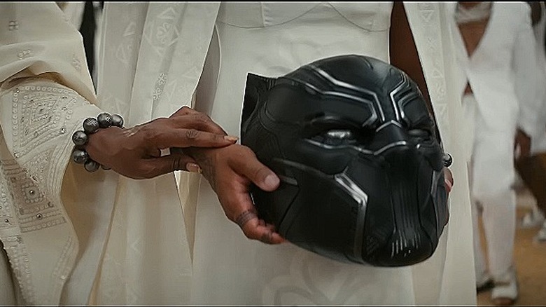 Black Panther helmet in hands