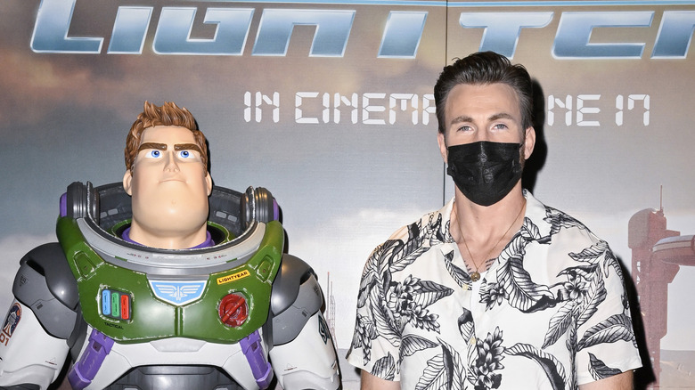 Chris Evans with a Buzz Lightyear statue