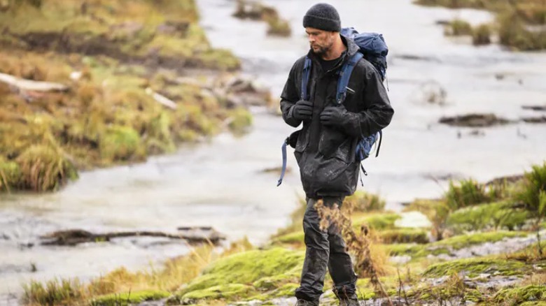 Chris Hemsworth walking in wilderness