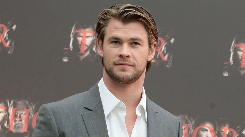 Chris Hemsworth posing Thor photocall